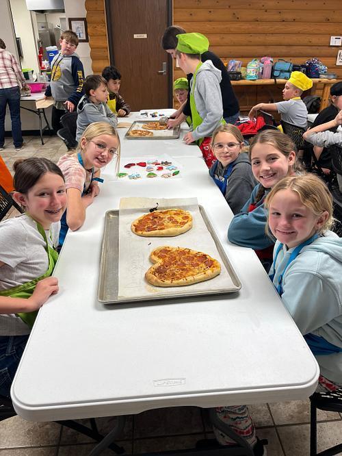 waiting to their pizza to cool