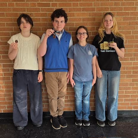 Students show off their new medals they won at the Three Rivers League Forensics Tournament.