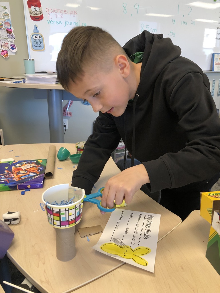 third grader working on a project