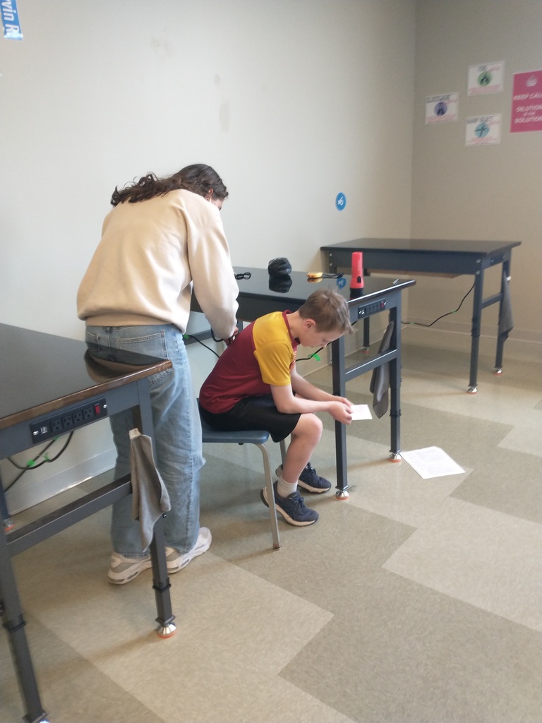high school student interviewing 6th grader
