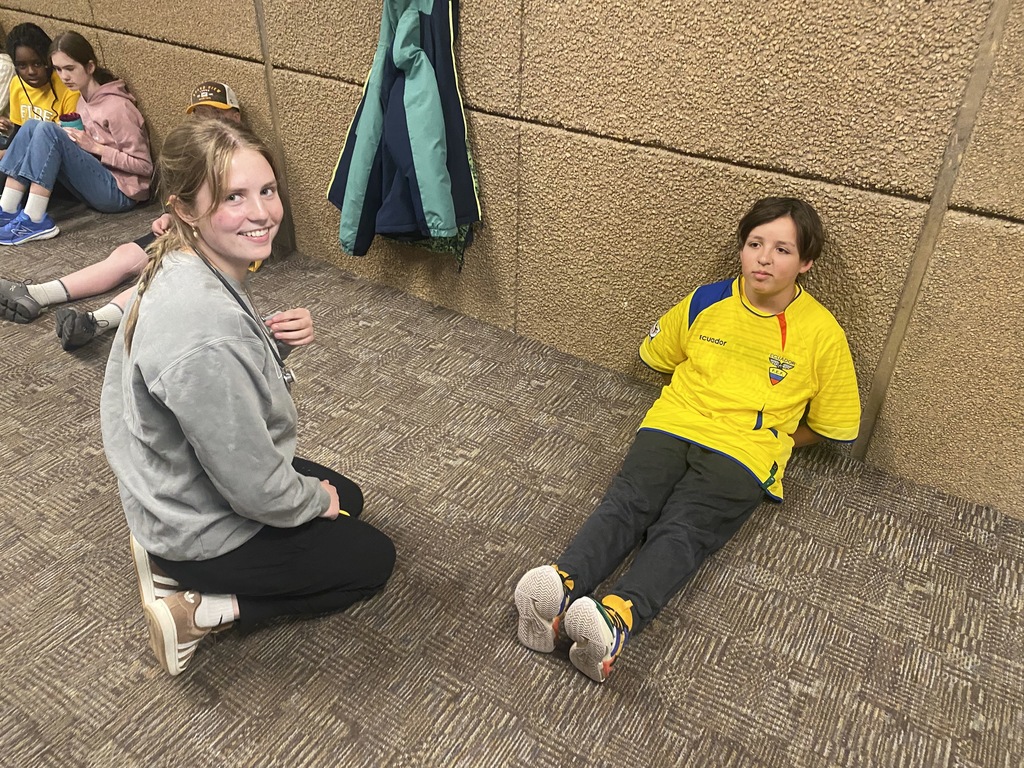 high school student interviewing 6th grader