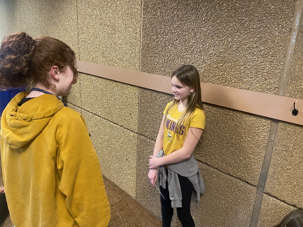 high school student interviewing 6th grader