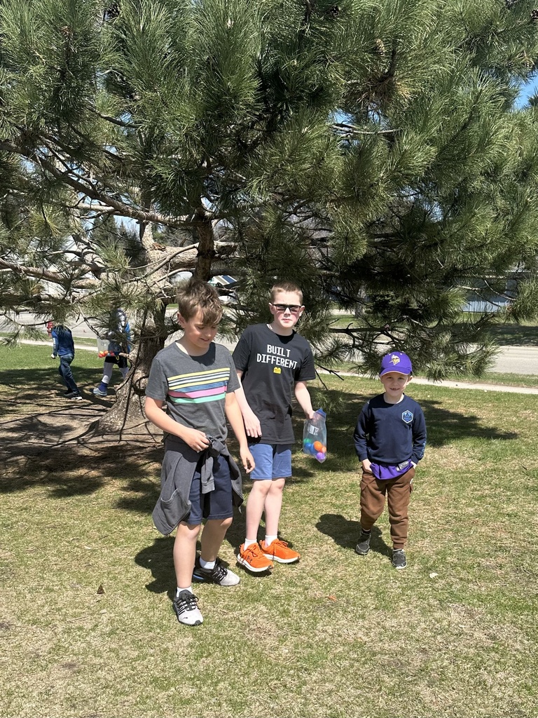 elementary students on an egg hunt