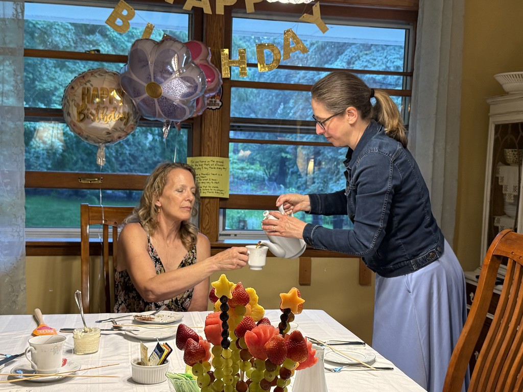 guest of honor being served tea