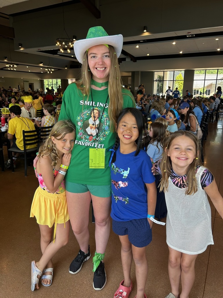 UCA 1st grade teacher at a summer church camp with some former students