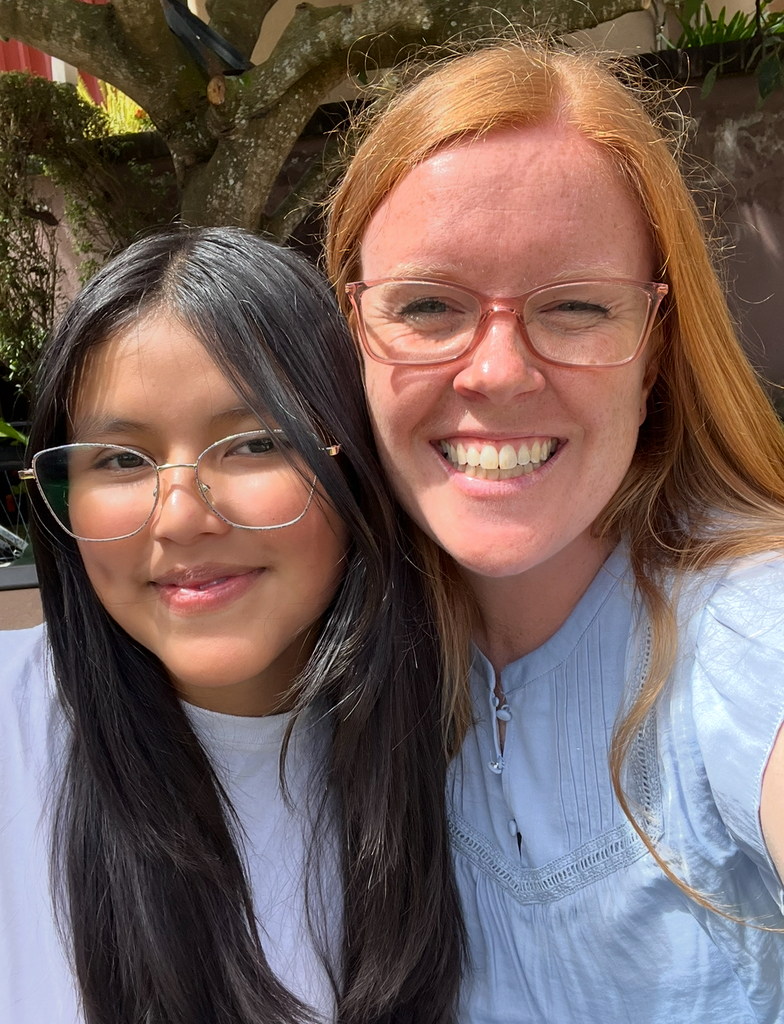 UCA teacher in Guatemala pictured with a child our school sponsors