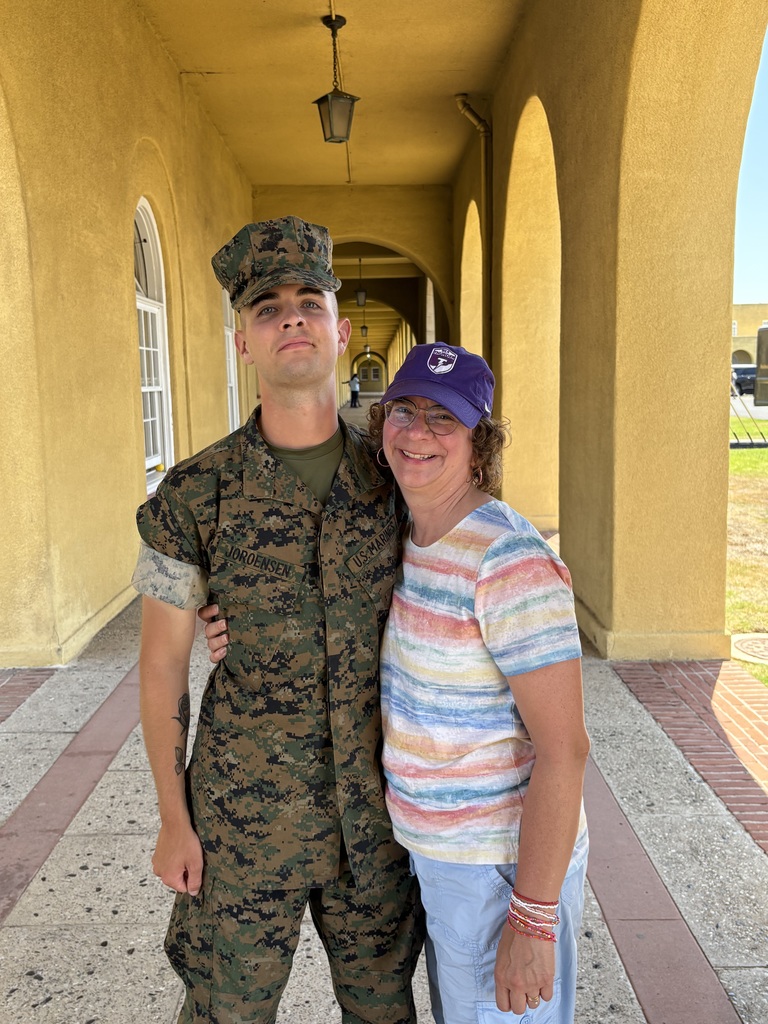 UCA teacher with her son as he graduated Marine boot camp