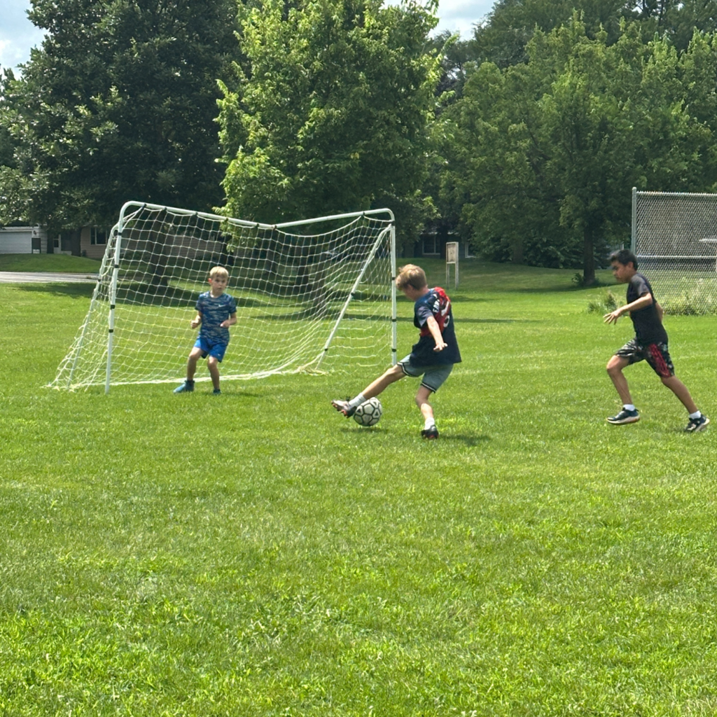 students playing soccer