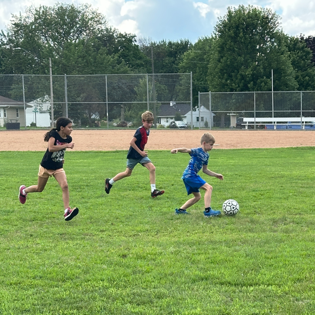 students playing soccer