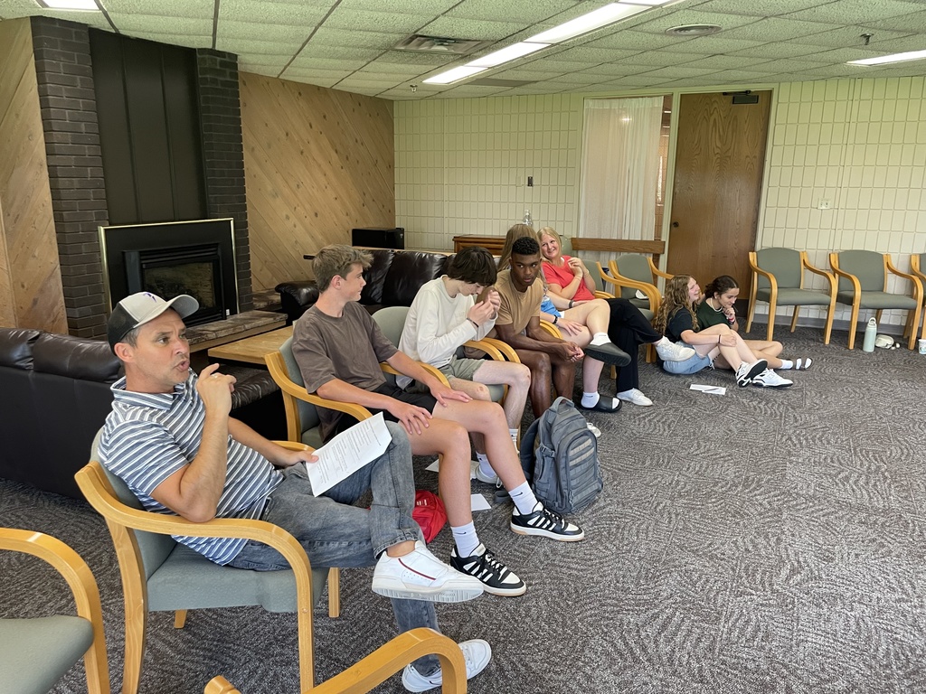small groups of students at a leadership retreat