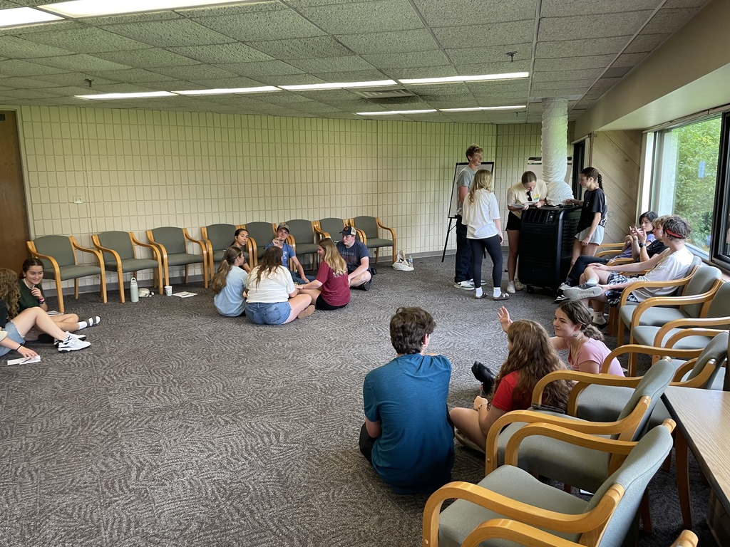 small groups of students at a retreat