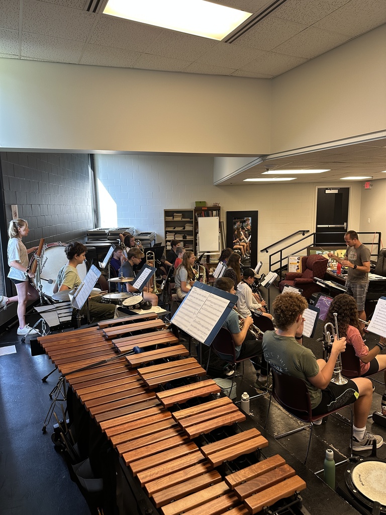band students practicing with their director