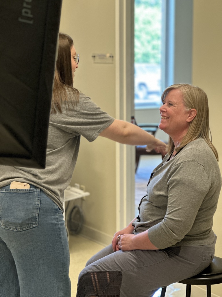 staff member having her head shot taken