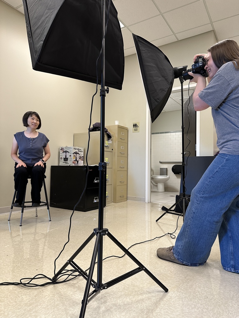 staff member having her head shot taken