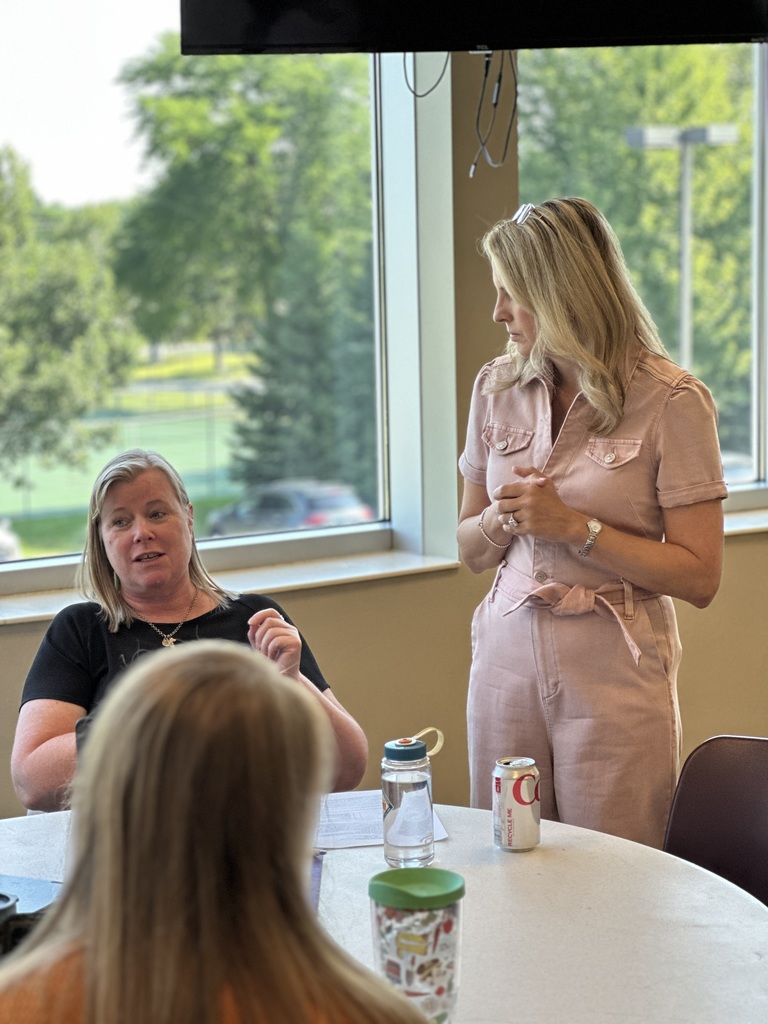a teacher having a discussion with the presenter