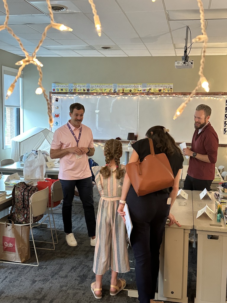 teacher talking to a family of one of his new students