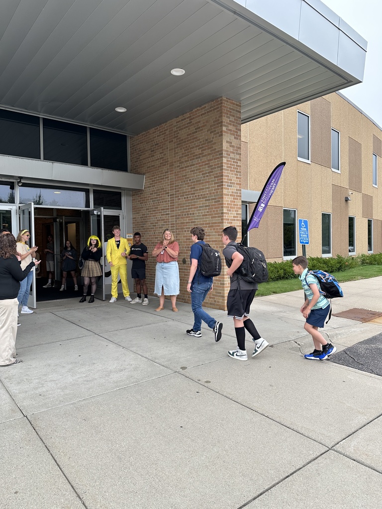 high school students walking into the building