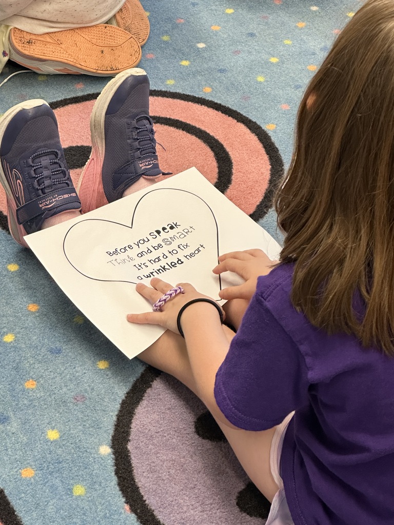 student holding the handout in her lap
