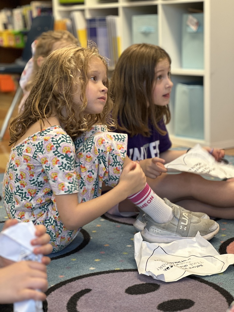 students listening to their teacher reading