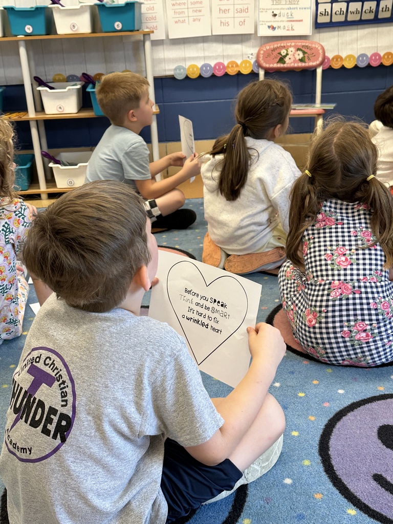 students listening to their teacher reading