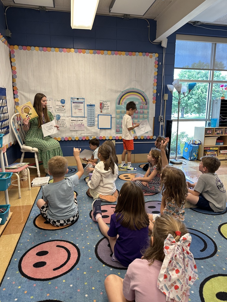 teacher reading to her 1st grade class