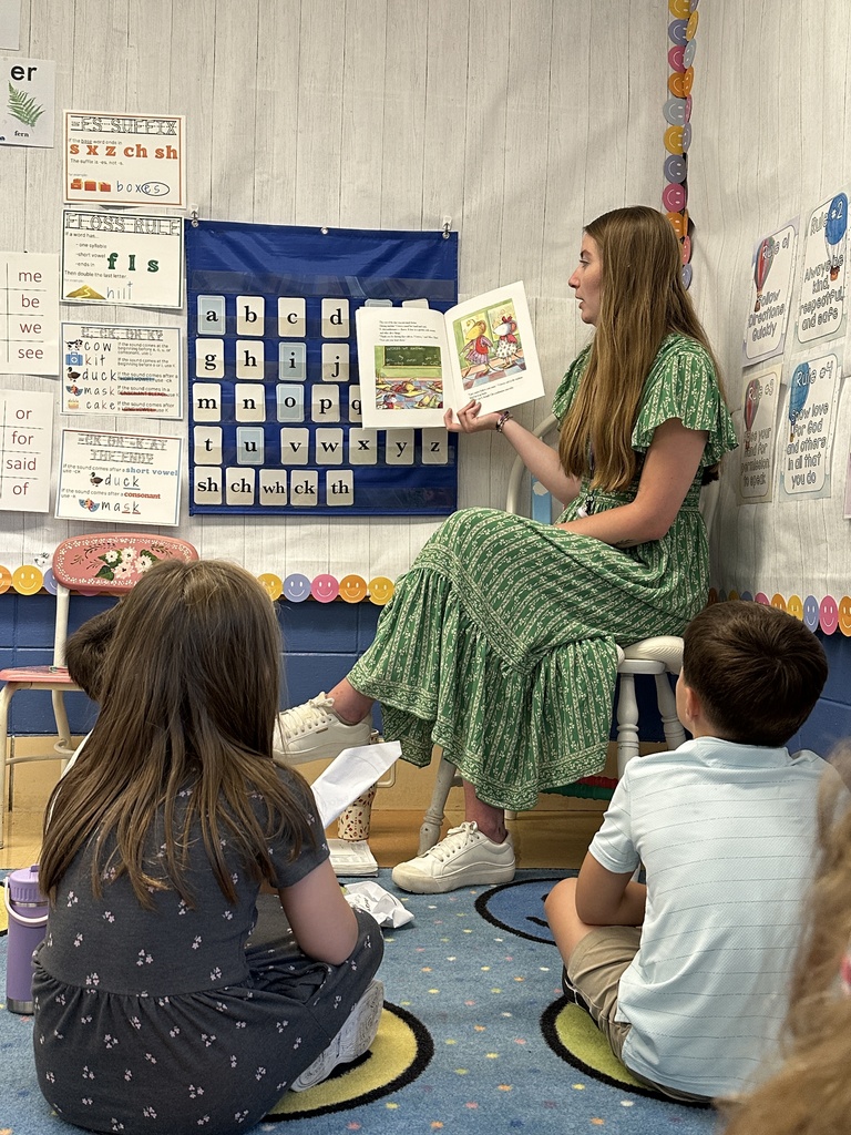 students listening to their teacher reading