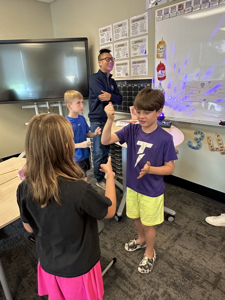 students playing rock, paper, scissors