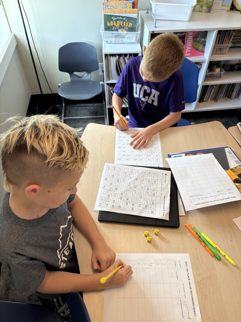 students at their desk working on a math assignment