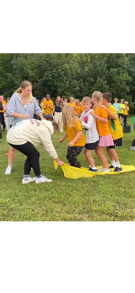 secondary students playing a relay game with their house teams