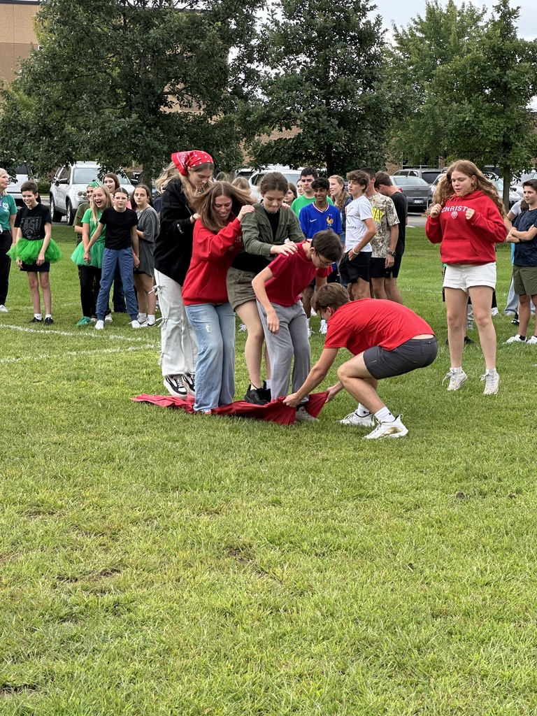 secondary students playing a relay game with their house teams