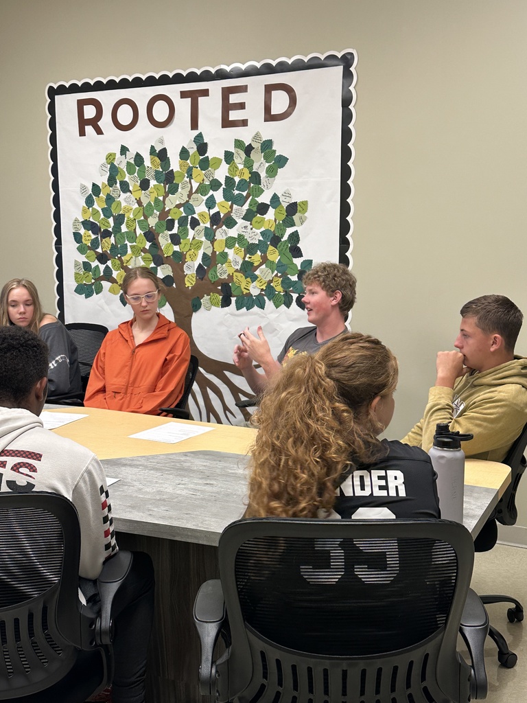 group of senior leaders sitting at a table for a meeting