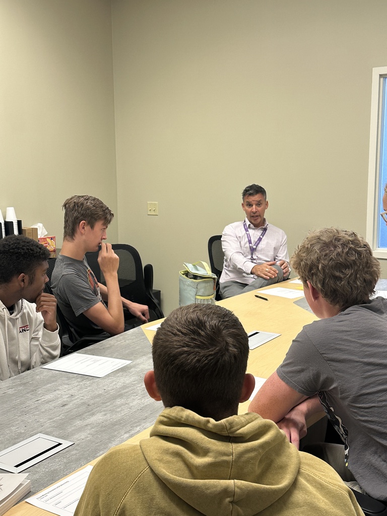 head of school speaking with senior leaders