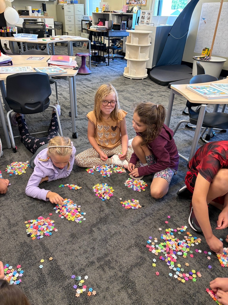 3rd grade students using counting strategies to count a large pile of small objects