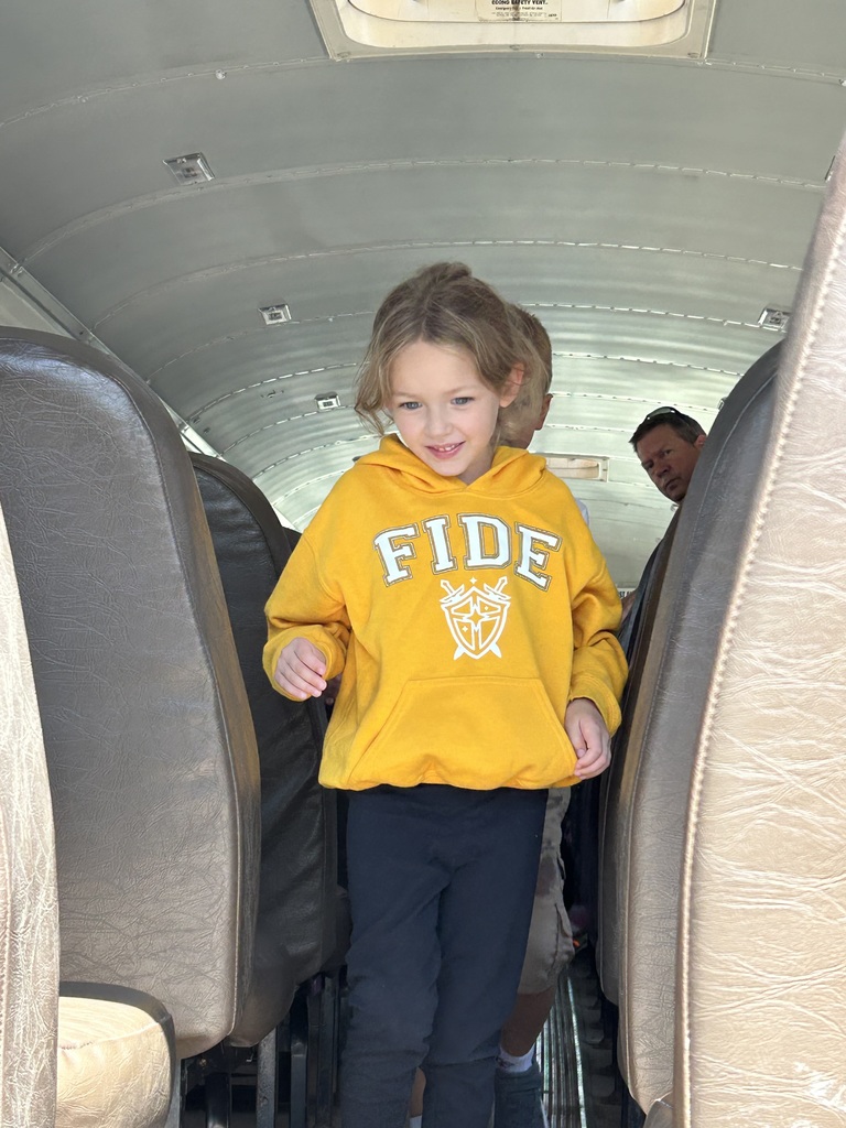 student practicing exiting the back of the bus
