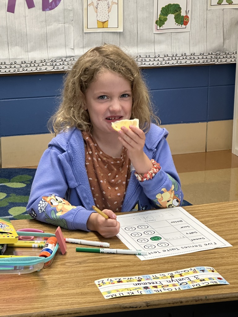 student making a funny face after tasting a lemon