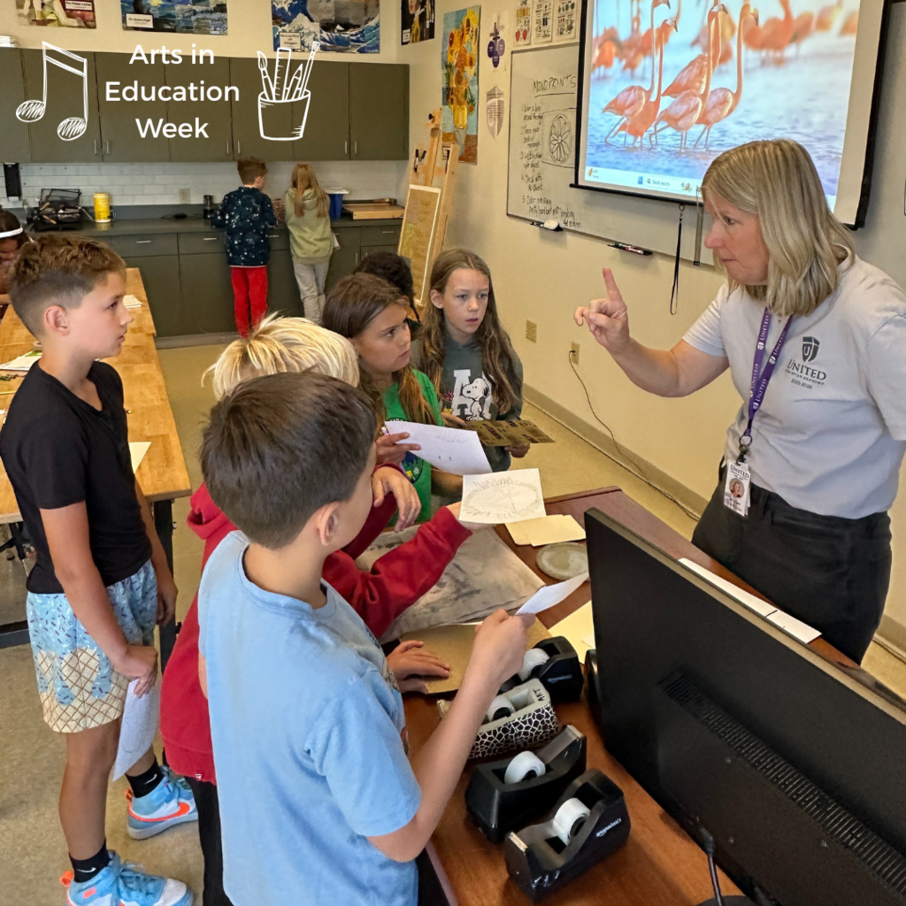 art teacher talking to a group of students