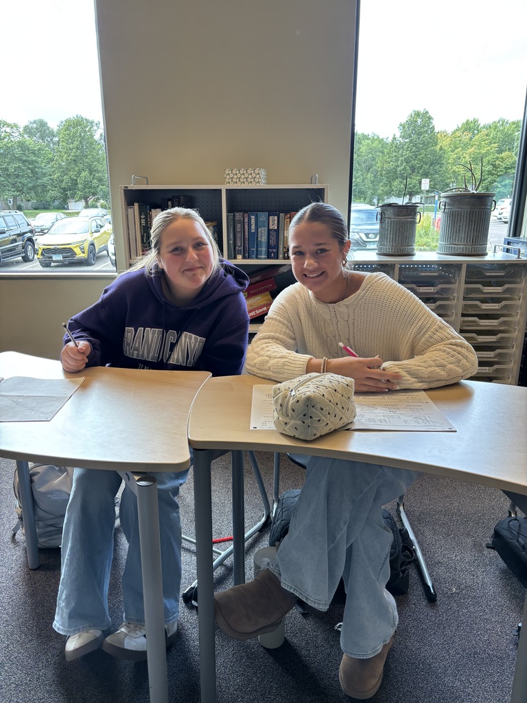 two high school girls working on a Chinese assignment