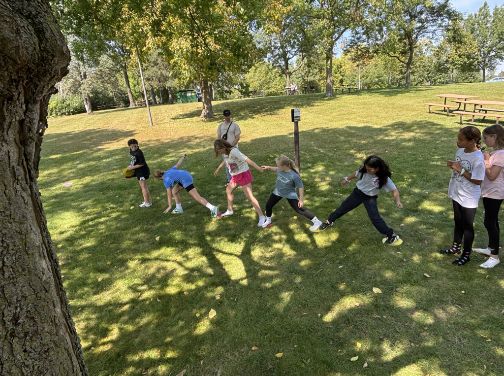 6th grade girls doing a team-building exercise