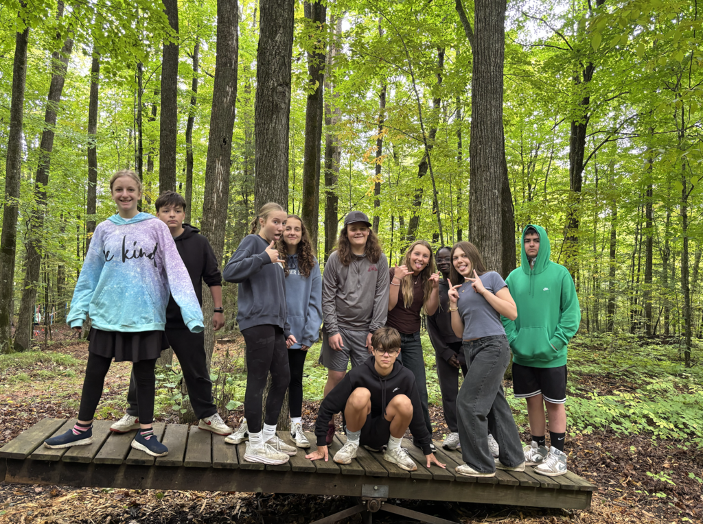 middle schoolers doing a team-building exercise