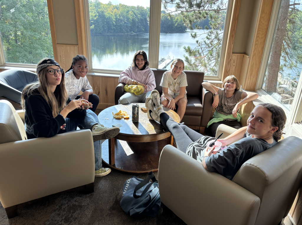 group of 7th and 8th grade girls hanging out on couches