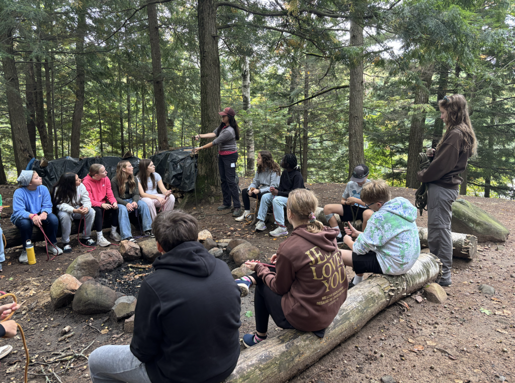 group of 7th and 8th graders learning how to tie knots