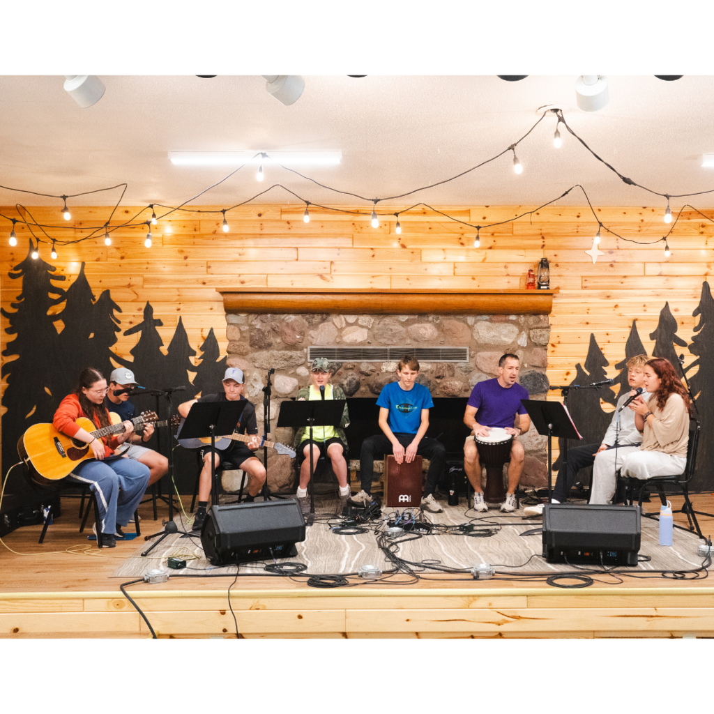 students leading worship on stage