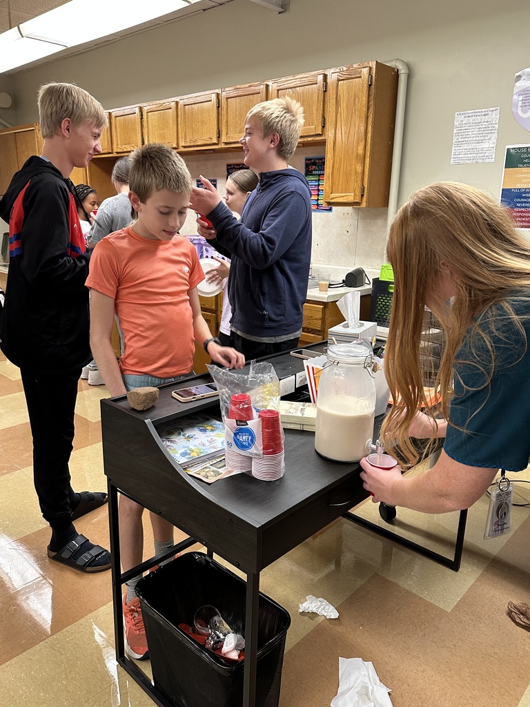 student being served a glass of horchata