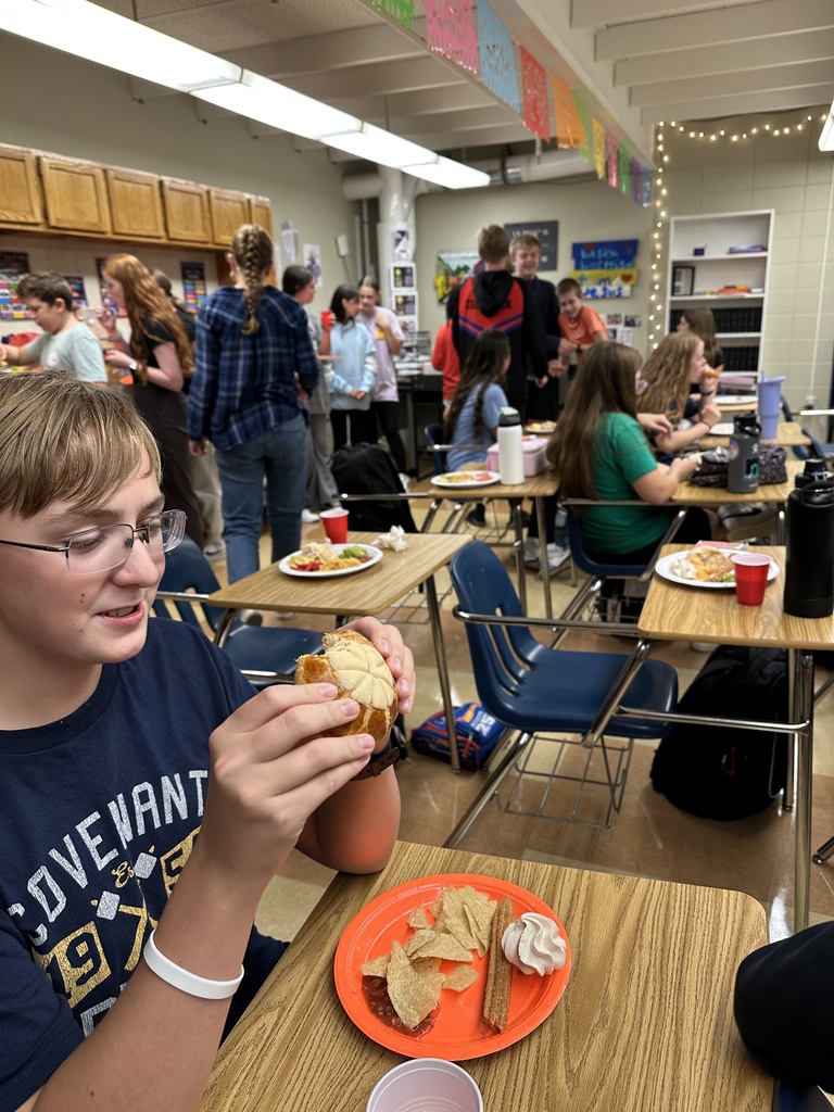 students eating food at a classroom party