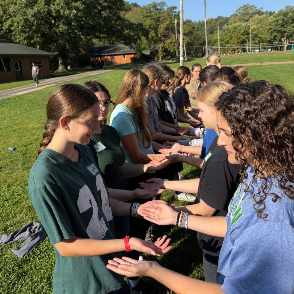 high school girls doing a team-building exercise