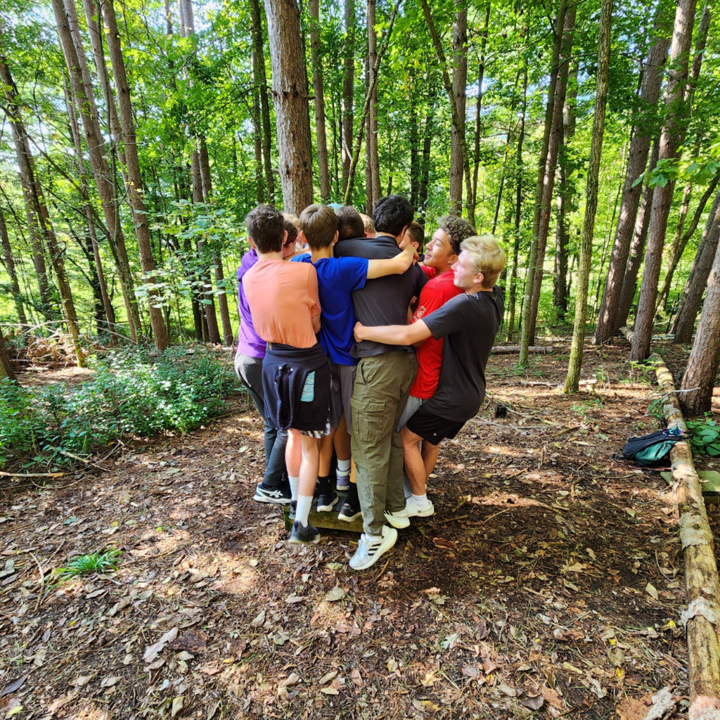 group of high school boys doing a team-building exercise