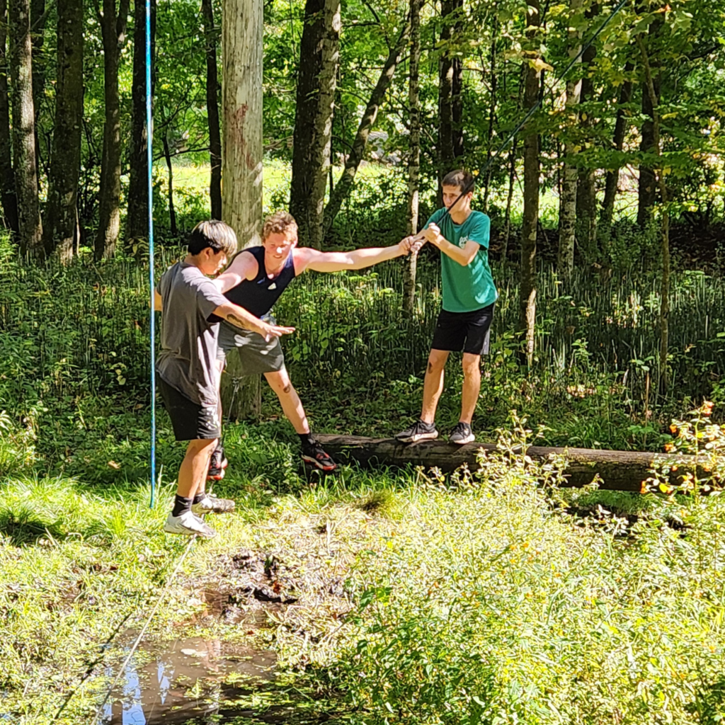 group of high school boys doing a team-building exercise