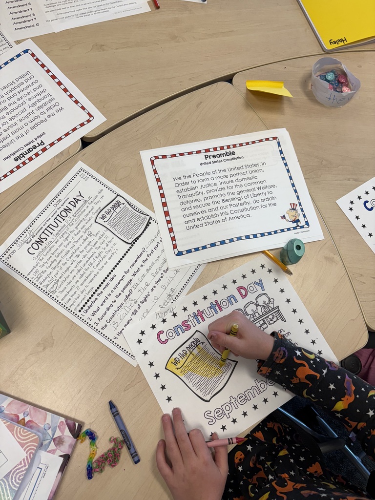 3rd grade student working on a coloring sheet