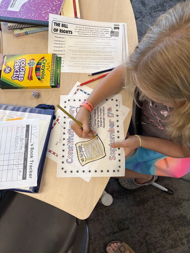 3rd grade student working on a coloring sheet