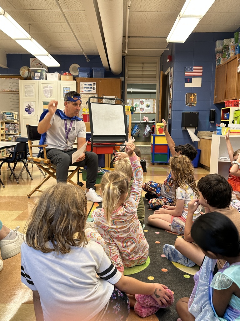 head of school reading to the kindergarten students